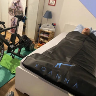 triathlete relaxing in sauna blanket