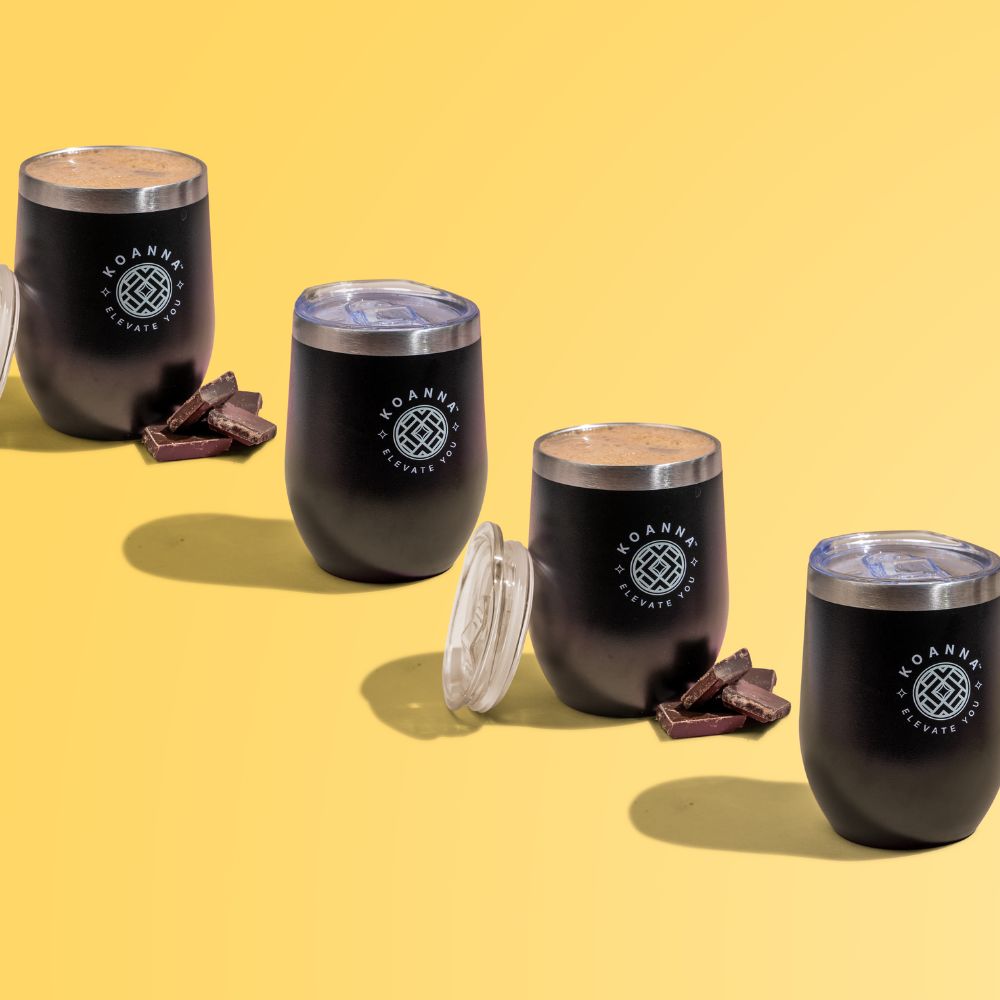 A set of Elevate cups filled with Focus+ and next to them chocolate pieces.